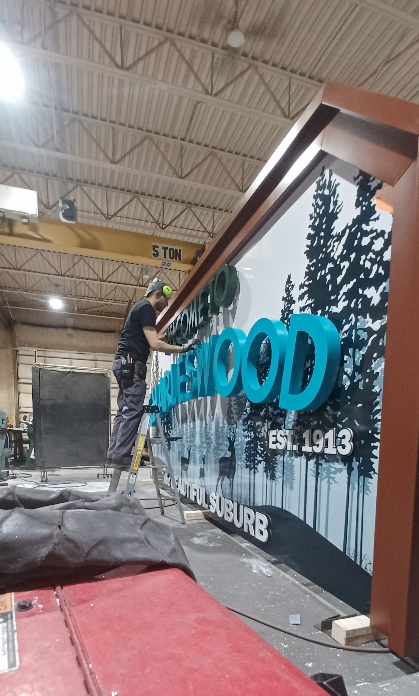 David installing signage